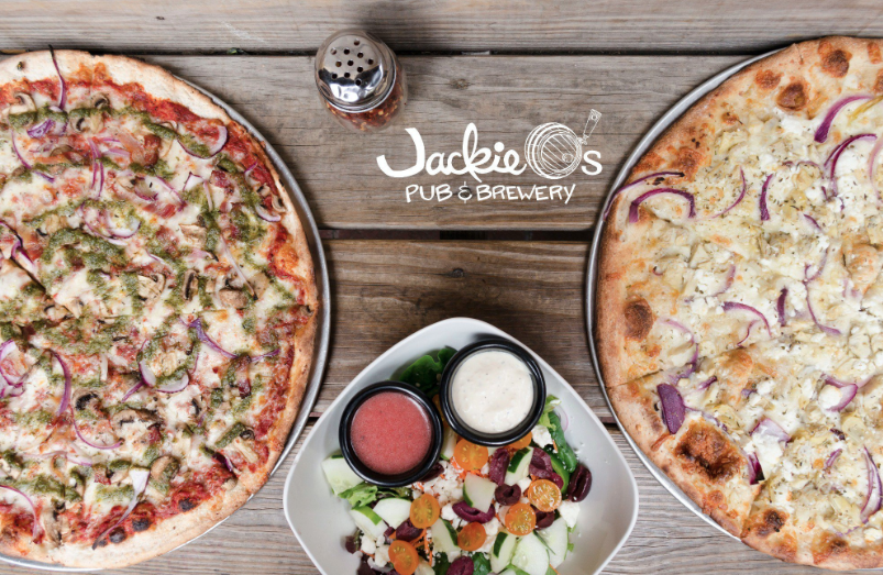 Photo of two specialty pizzas and a salad from Jackie O's Brewery